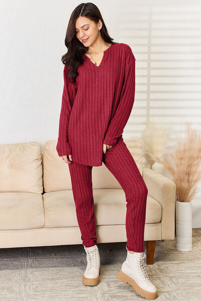Basic Bae Full Size Notched Long Sleeve Top and Pants Set displayed on a mannequin, showcasing its stylish design and comfortable fit.