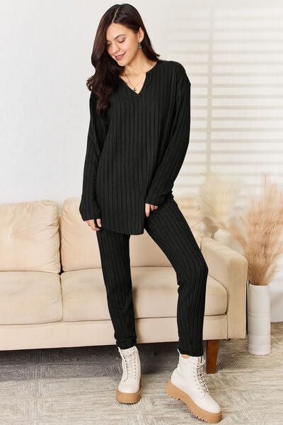 Basic Bae Full Size Notched Long Sleeve Top and Pants Set displayed on a mannequin, showcasing its stylish design and comfortable fit.