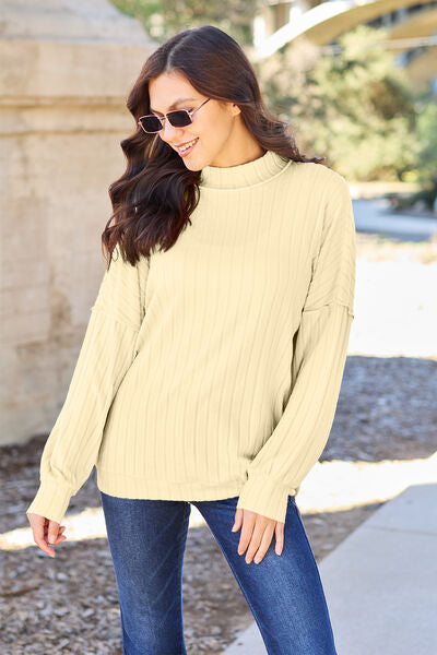 Basic Bae Full Size Ribbed Mock Neck Knit Top in various colors, showcasing its ribbed texture and mock neck design.