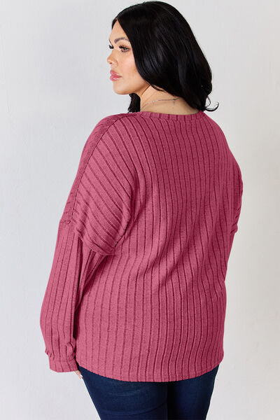Basic Bae Full Size Ribbed Half Button Long Sleeve T-Shirt in a stylish ribbed design, showcasing its half-button feature and comfortable fit.