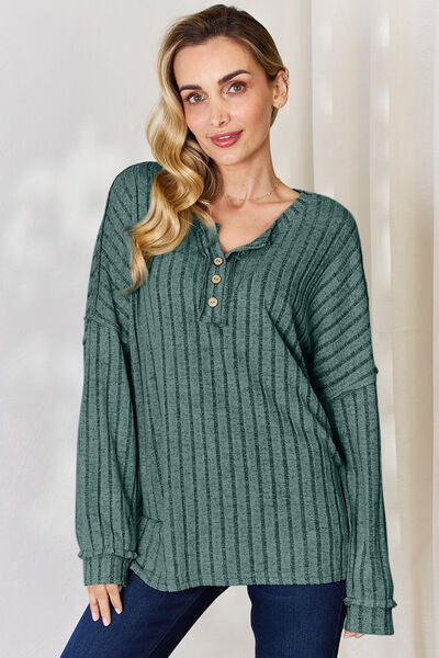 Basic Bae Full Size Ribbed Half Button Long Sleeve T-Shirt in a stylish ribbed design, showcasing its half-button feature and comfortable fit.