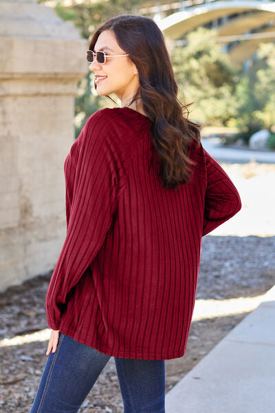 Basic Bae Full Size Ribbed Round Neck Long Sleeve Knit Top in a stylish ribbed design, showcasing its round neckline and long sleeves.