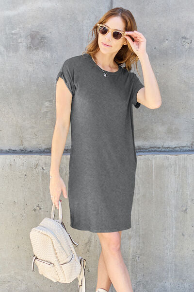 Basic Bae Full Size Round Neck Short Sleeve Dress in a solid color with pockets, showcasing its casual style and comfortable fit.