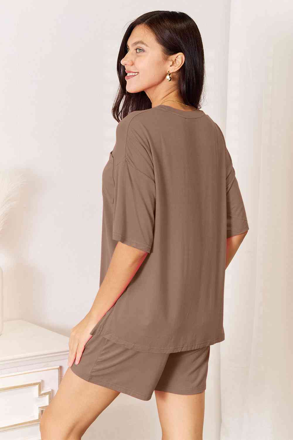 Basic Bae Full Size Soft Rayon Half Sleeve Top and Shorts Set displayed on a mannequin, showcasing its relaxed fit and stylish design.