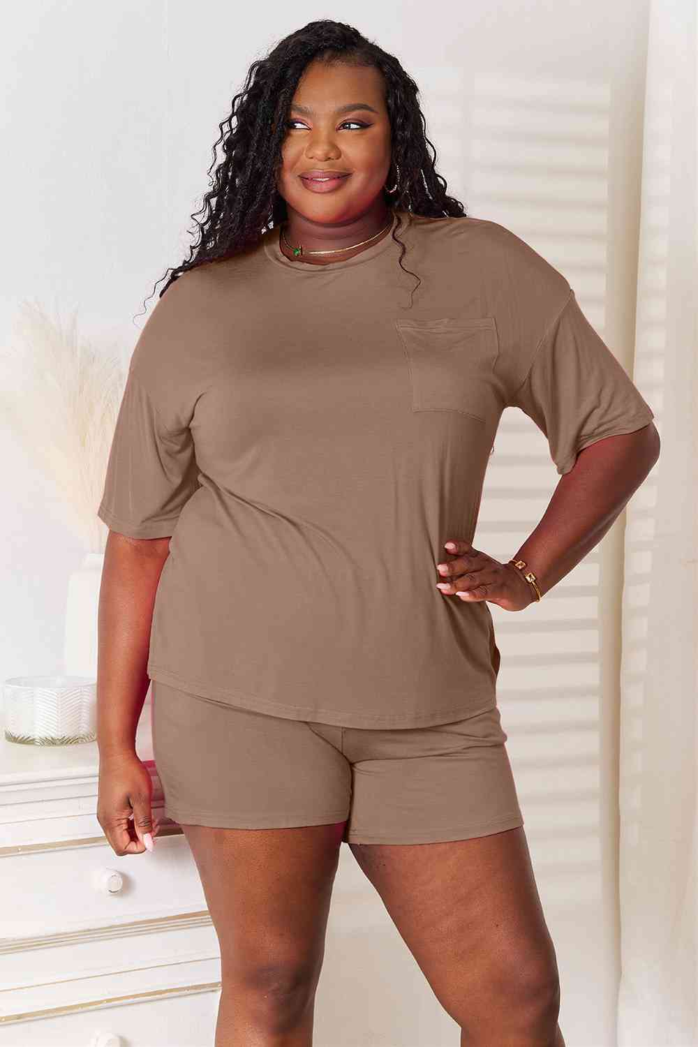 Basic Bae Full Size Soft Rayon Half Sleeve Top and Shorts Set displayed on a mannequin, showcasing its relaxed fit and stylish design.