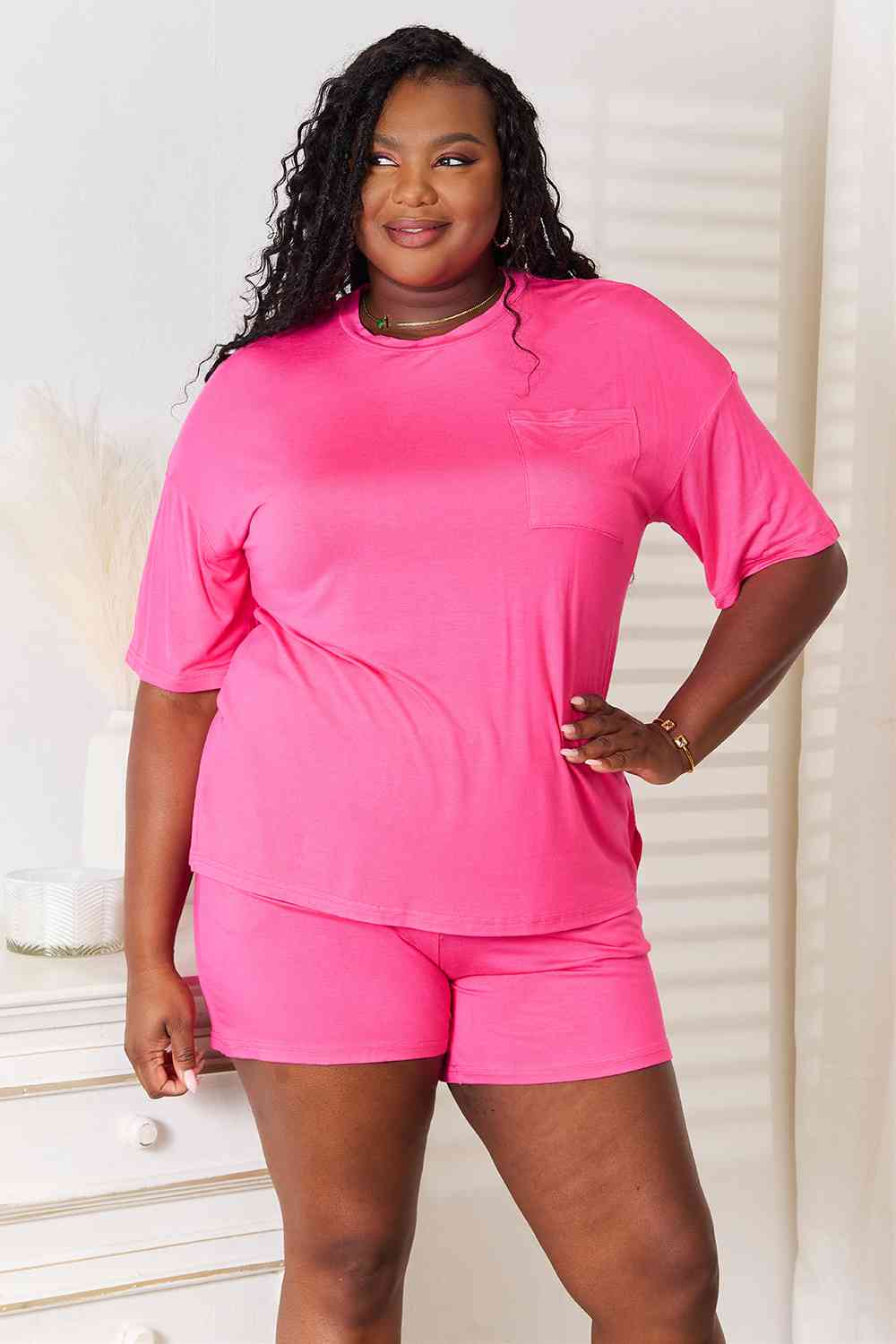 Basic Bae Full Size Soft Rayon Half Sleeve Top and Shorts Set displayed on a mannequin, showcasing its relaxed fit and stylish design.