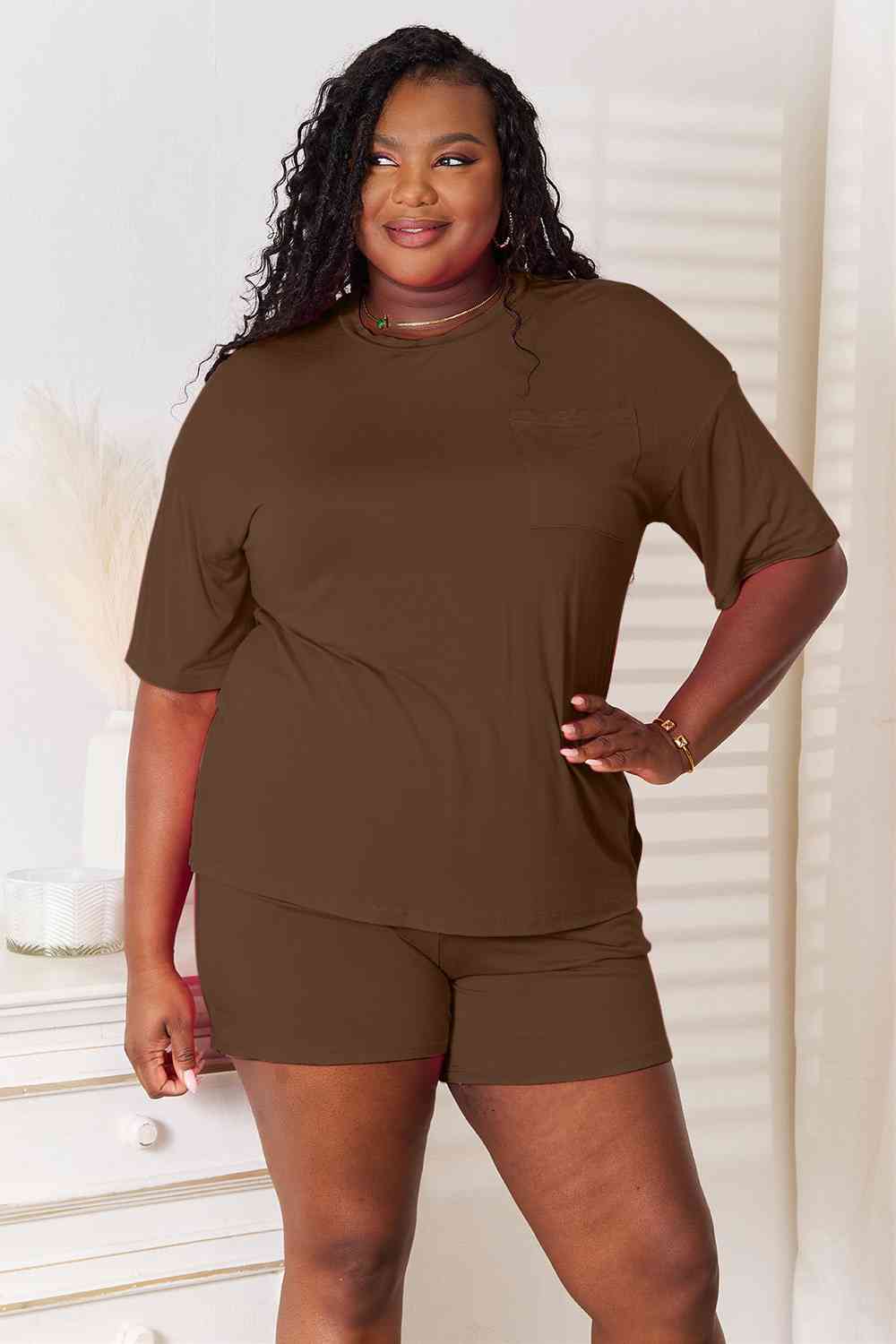 Basic Bae Full Size Soft Rayon Half Sleeve Top and Shorts Set displayed on a mannequin, showcasing its relaxed fit and stylish design.