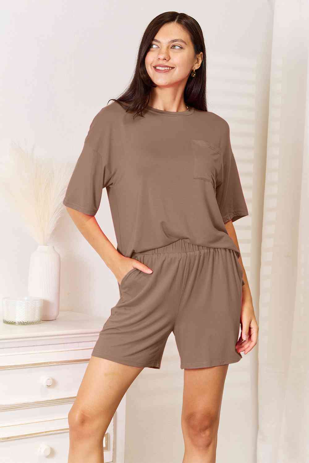 Basic Bae Full Size Soft Rayon Half Sleeve Top and Shorts Set displayed on a mannequin, showcasing its relaxed fit and stylish design.