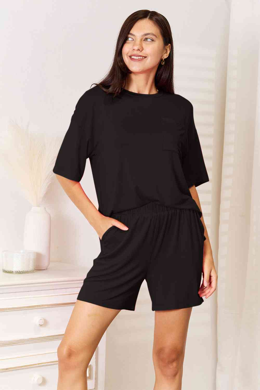 Basic Bae Full Size Soft Rayon Half Sleeve Top and Shorts Set displayed on a mannequin, showcasing its relaxed fit and stylish design.