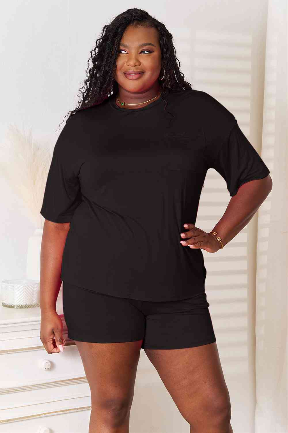 Basic Bae Full Size Soft Rayon Half Sleeve Top and Shorts Set displayed on a mannequin, showcasing its relaxed fit and stylish design.