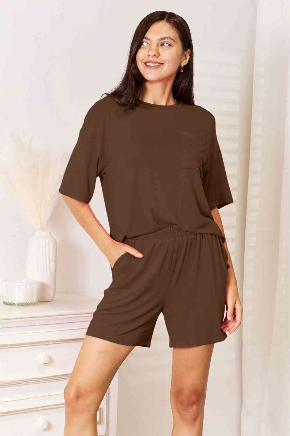 Basic Bae Full Size Soft Rayon Half Sleeve Top and Shorts Set displayed on a mannequin, showcasing its relaxed fit and stylish design.