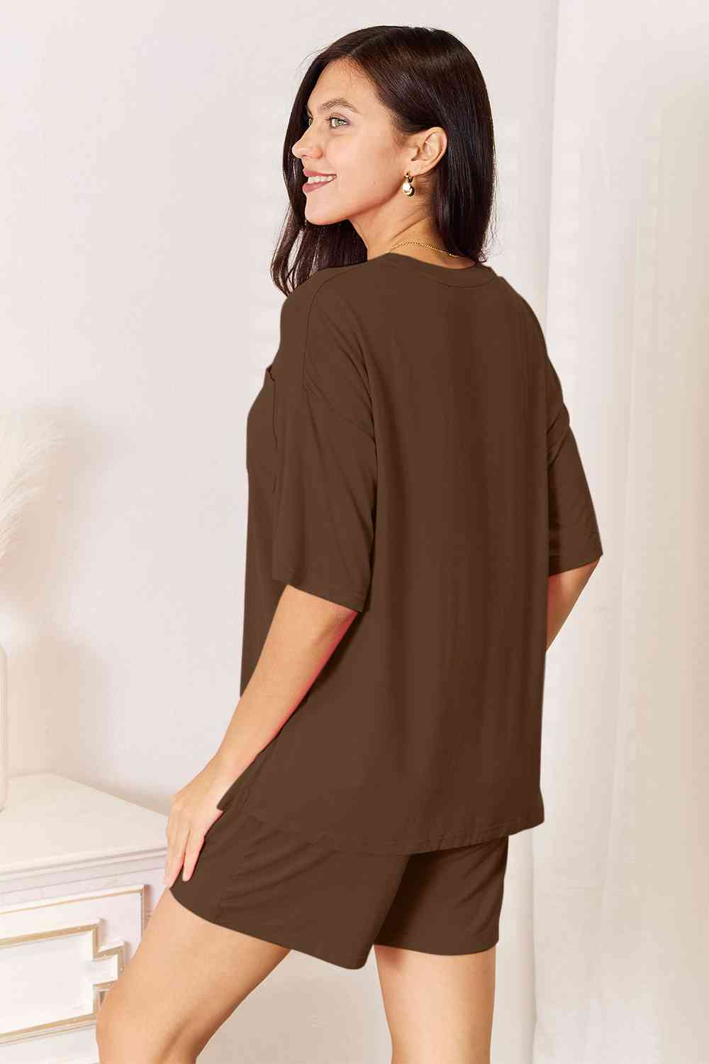 Basic Bae Full Size Soft Rayon Half Sleeve Top and Shorts Set displayed on a mannequin, showcasing its relaxed fit and stylish design.