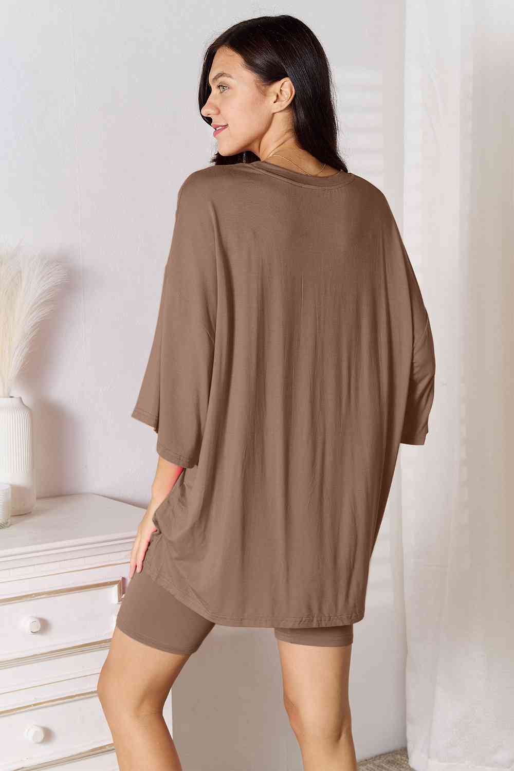 Basic Bae Full Size Soft Rayon Three-Quarter Sleeve Top and Shorts Set displayed on a mannequin, showcasing its soft fabric and stylish design.