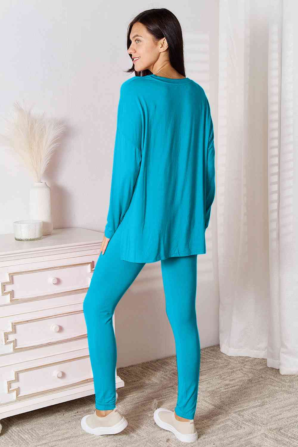 Basic Bae Full Size V-Neck Soft Rayon Long Sleeve Top and Pants Lounge set displayed on a model, showcasing its stylish design and comfortable fit.