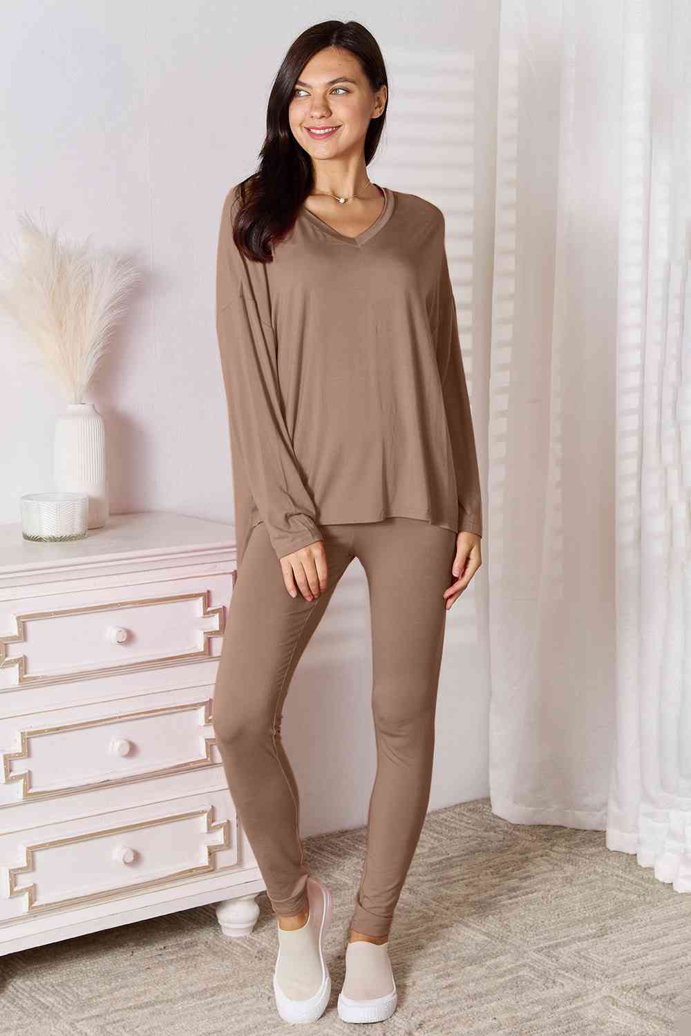 Basic Bae Full Size V-Neck Soft Rayon Long Sleeve Top and Pants Lounge set displayed on a model, showcasing its stylish design and comfortable fit.