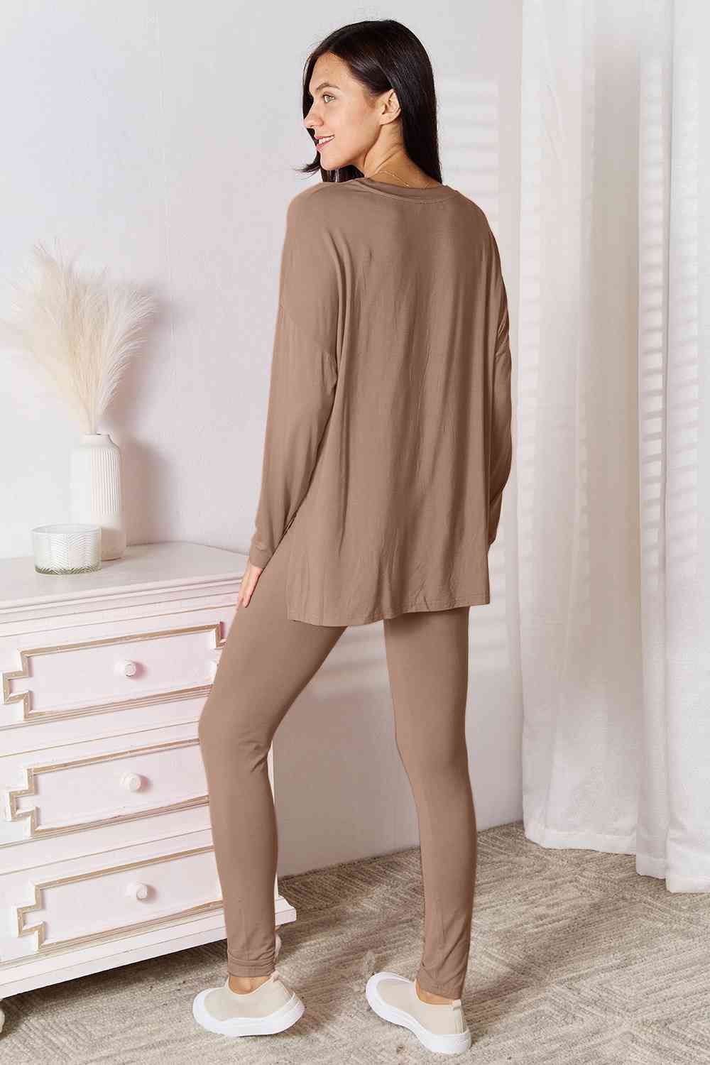 Basic Bae Full Size V-Neck Soft Rayon Long Sleeve Top and Pants Lounge set displayed on a model, showcasing its stylish design and comfortable fit.
