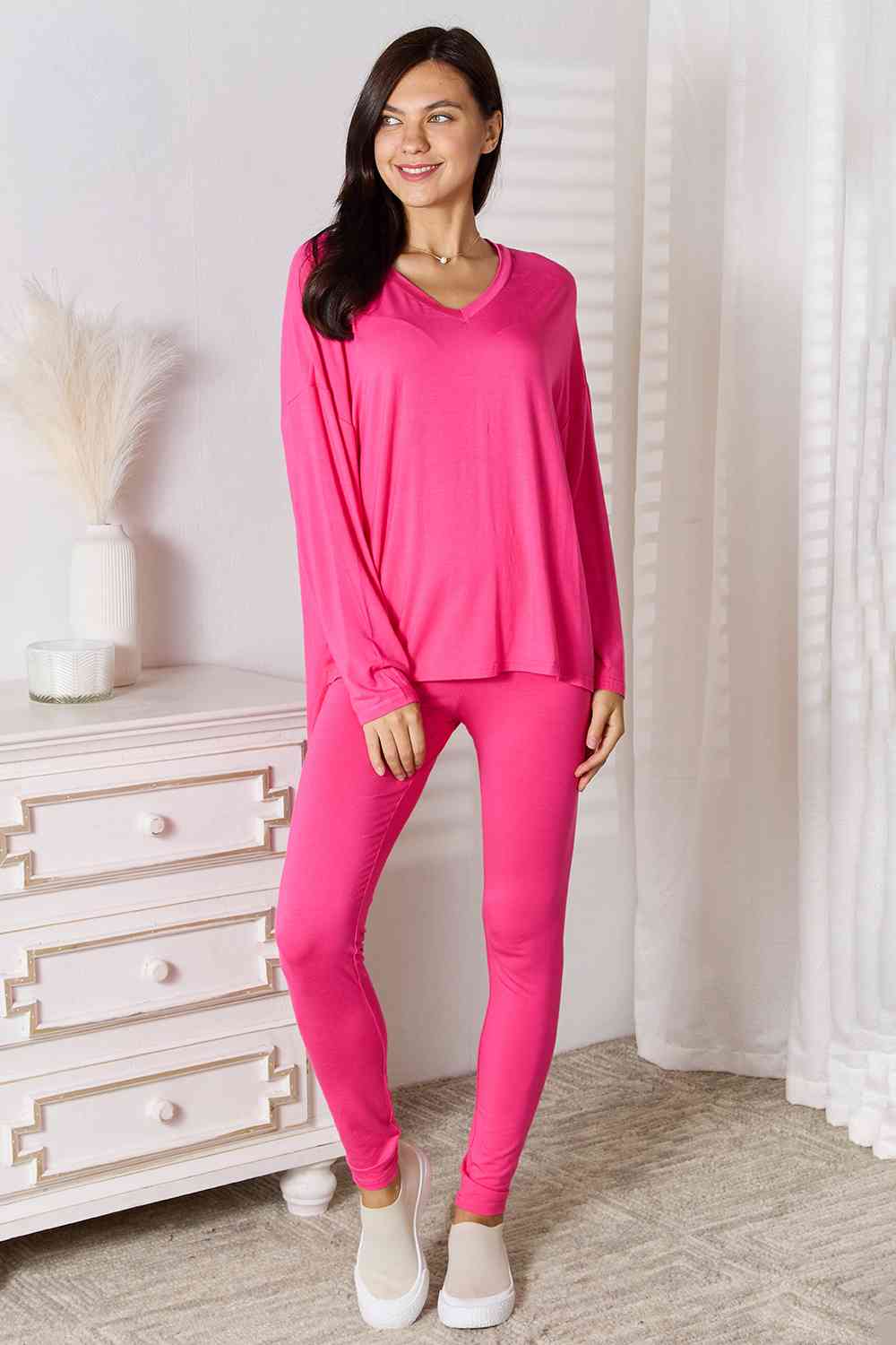 Basic Bae Full Size V-Neck Soft Rayon Long Sleeve Top and Pants Lounge set displayed on a model, showcasing its stylish design and comfortable fit.