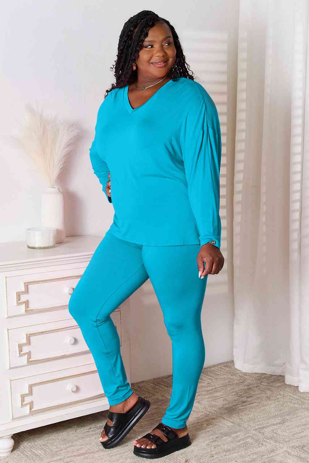 Basic Bae Full Size V-Neck Soft Rayon Long Sleeve Top and Pants Lounge set displayed on a model, showcasing its stylish design and comfortable fit.