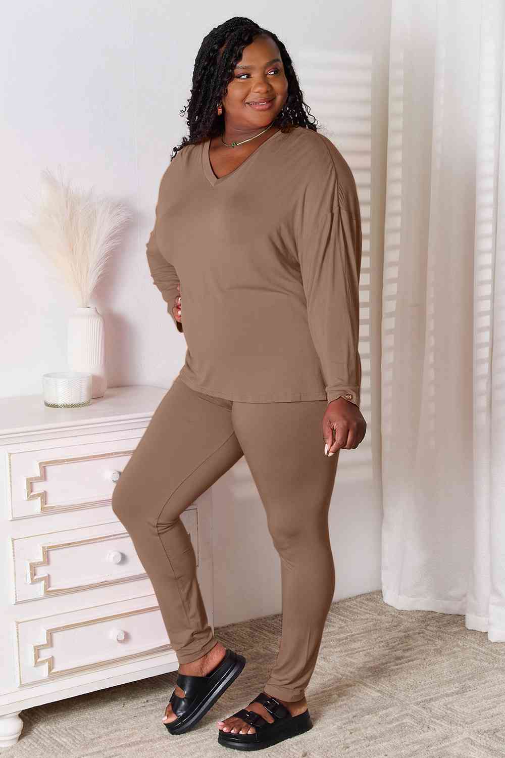Basic Bae Full Size V-Neck Soft Rayon Long Sleeve Top and Pants Lounge set displayed on a model, showcasing its stylish design and comfortable fit.