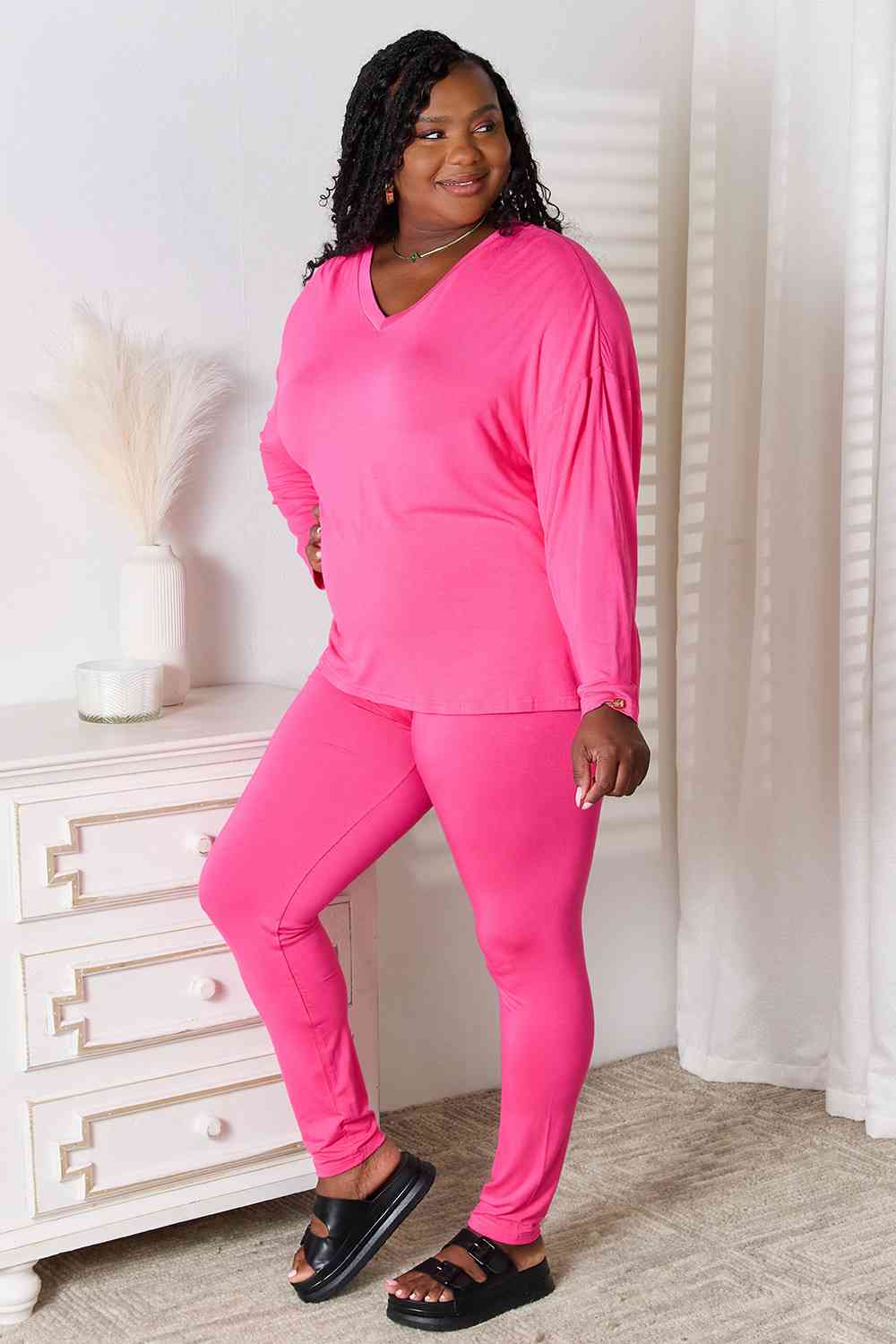 Basic Bae Full Size V-Neck Soft Rayon Long Sleeve Top and Pants Lounge set displayed on a model, showcasing its stylish design and comfortable fit.