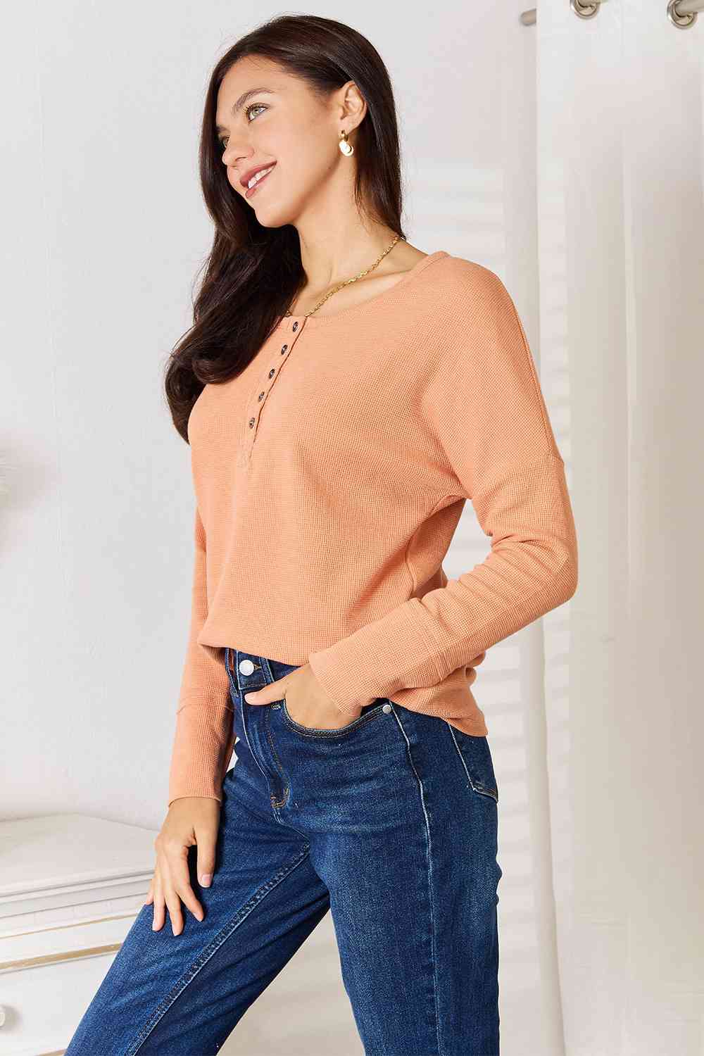 Basic Bae Half Button Long Sleeve Top in a chic design, featuring a half-button front and long sleeves, perfect for versatile styling.