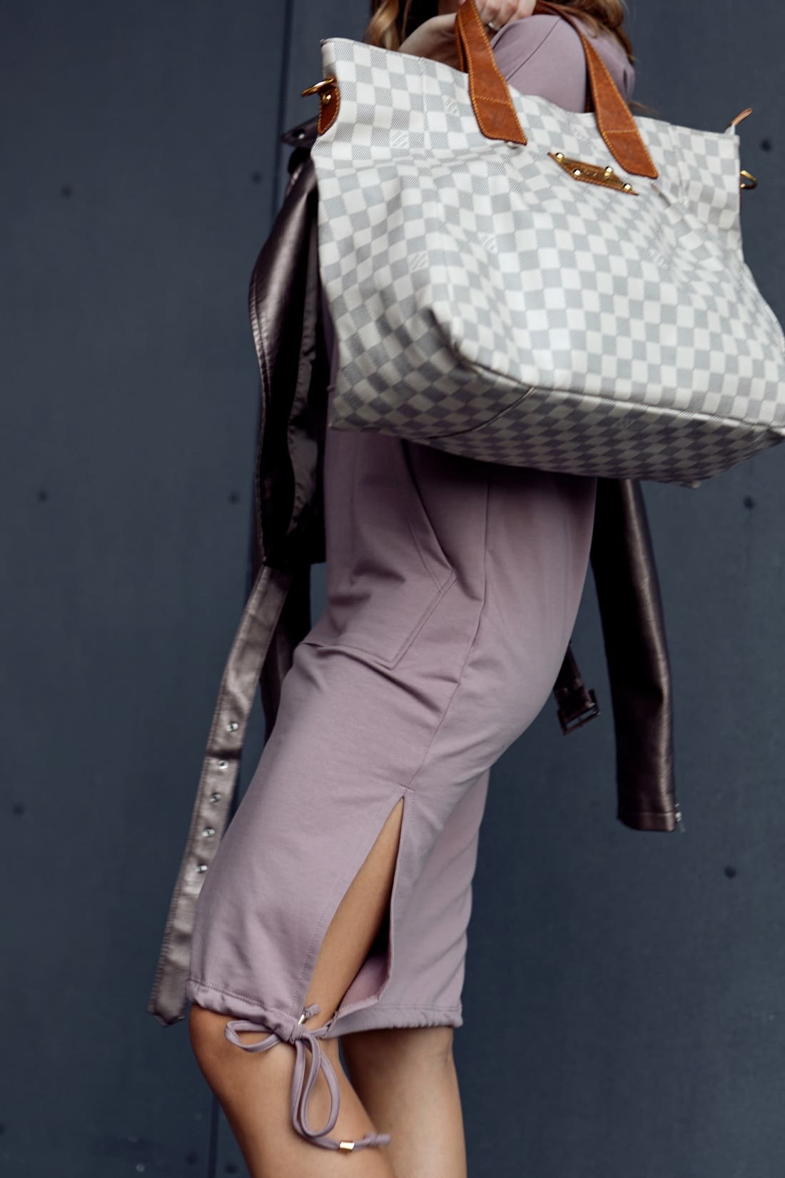 Cappuccino basic dress with a hood, pocket, and ties, showcasing long sleeves and a stylish design.