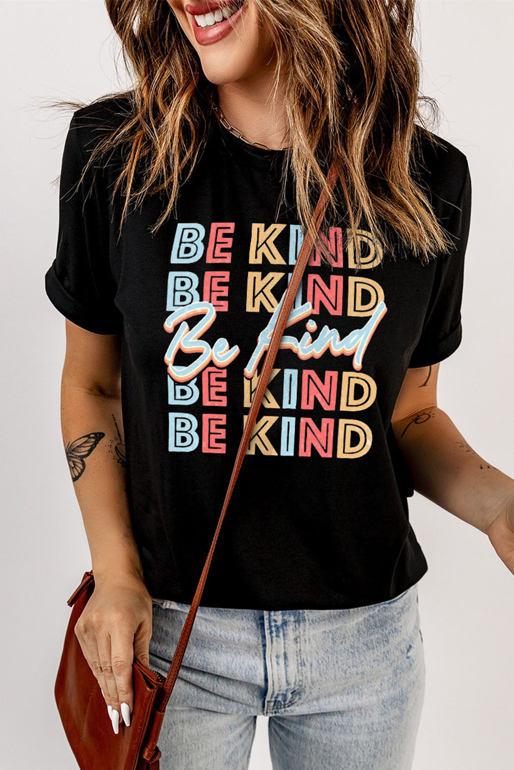 BE KIND Graphic Short Sleeve Tee featuring a round neck and short sleeves, made from a soft polyester and spandex blend with a vibrant graphic design.