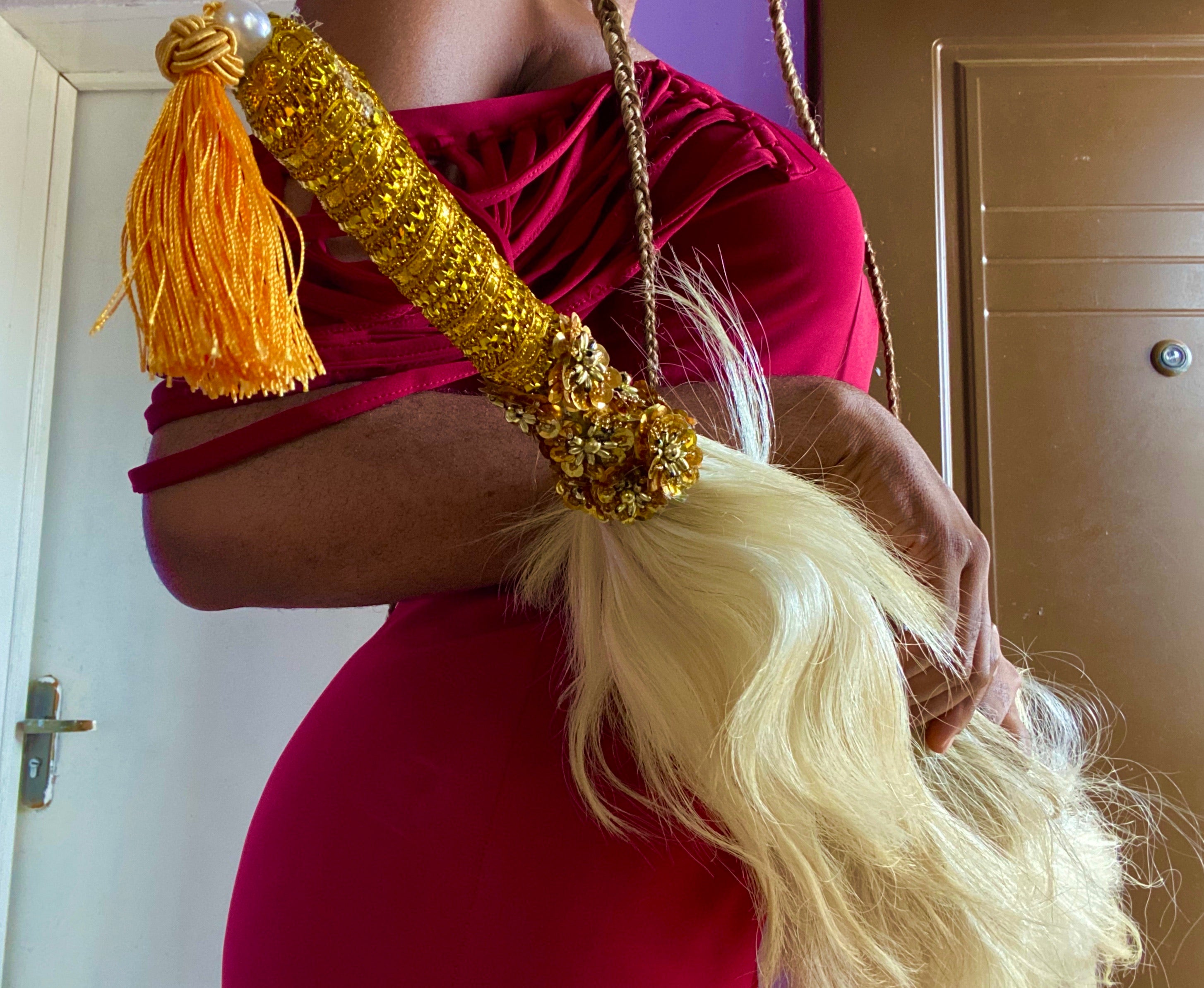 A beautifully embellished Bedazzled African wedding accessory featuring intricate designs and vibrant colors, perfect for brides.