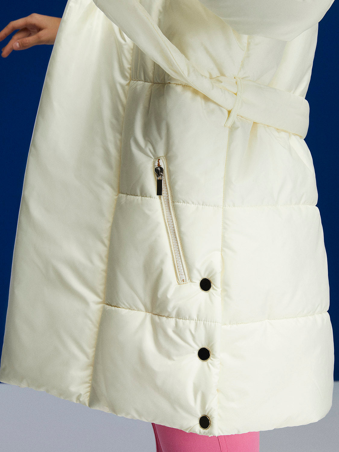 Belted Puffer Jacket featuring a double-breasted design, oversized fit, and side zipper pockets, perfect for stylish winter wear.