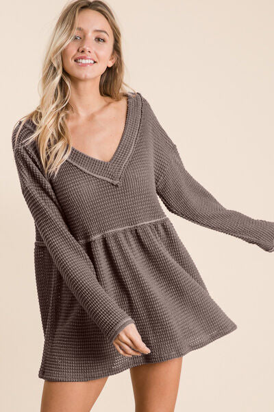 BiBi Waffle Knit V-Neck Babydoll Blouse in a stylish design featuring a textured waffle knit fabric and a flattering V-neckline.
