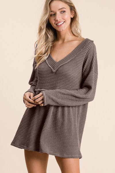 BiBi Waffle Knit V-Neck Babydoll Blouse in a stylish design featuring a textured waffle knit fabric and a flattering V-neckline.