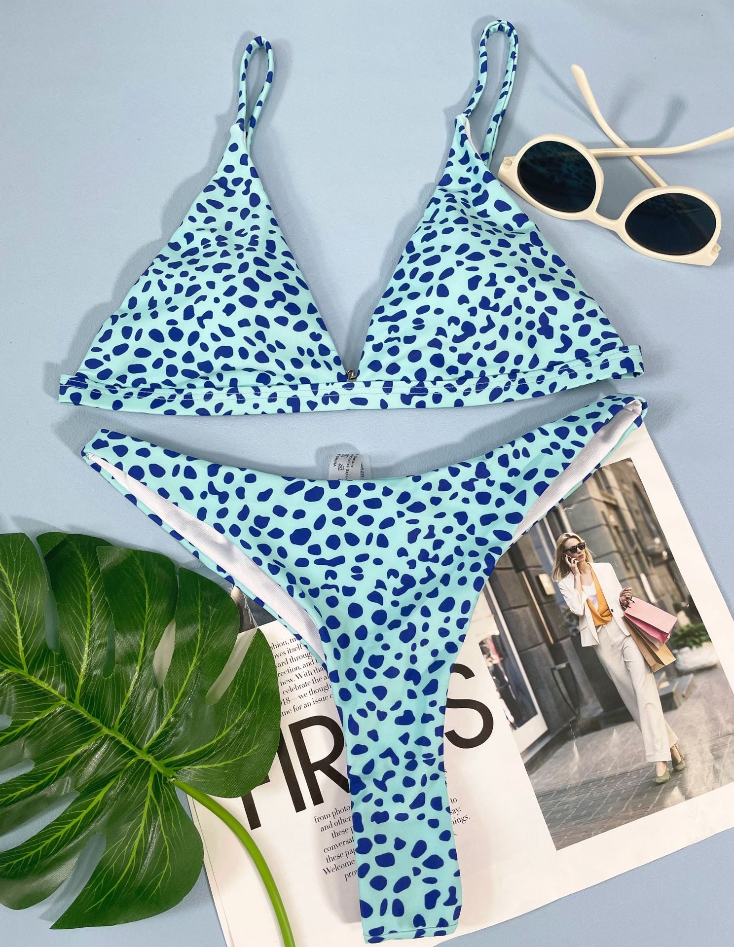 A stylish three-point bikini featuring a double print design, perfect for summer beach outings.