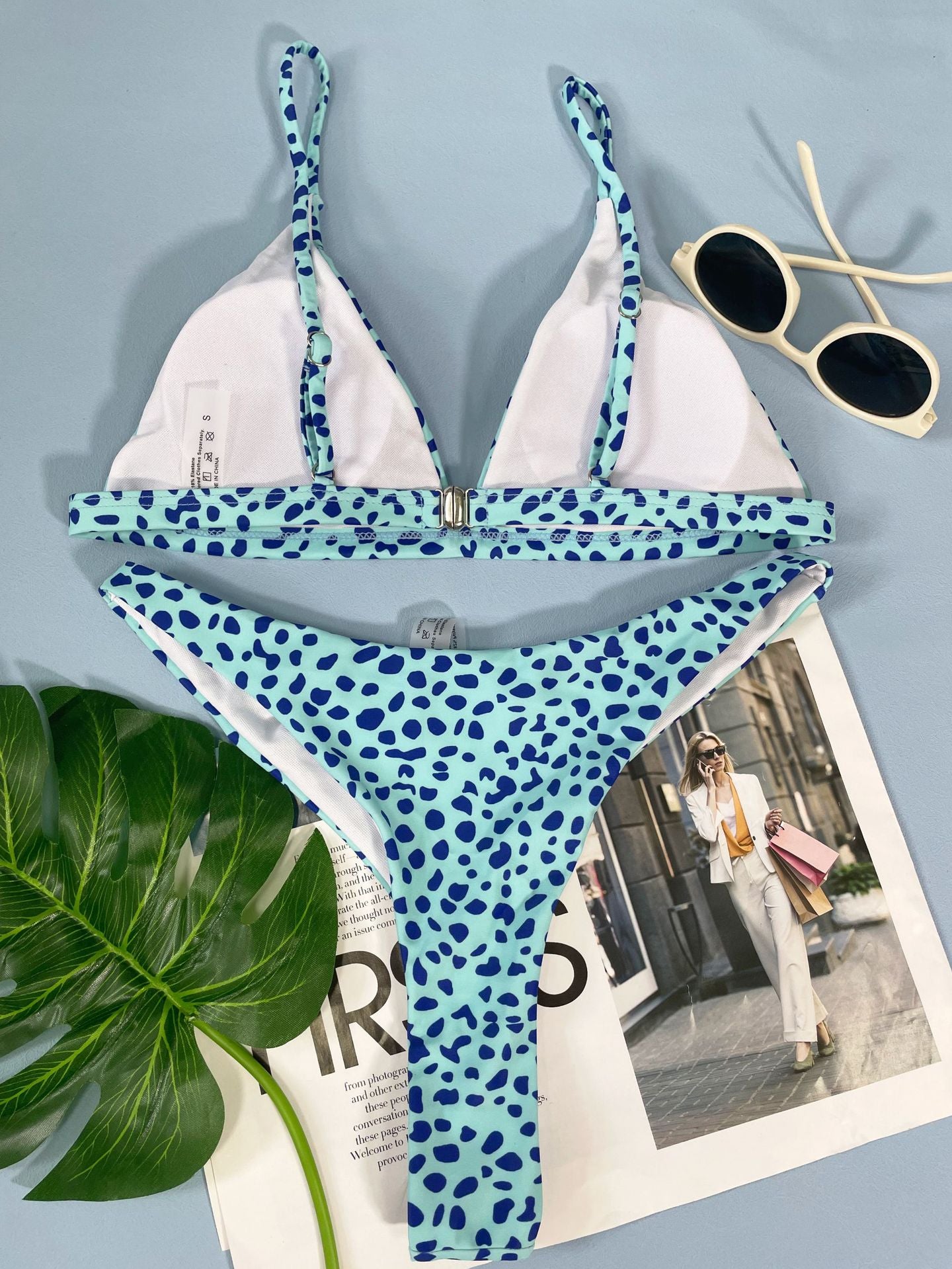 A stylish three-point bikini featuring a double print design, perfect for summer beach outings.