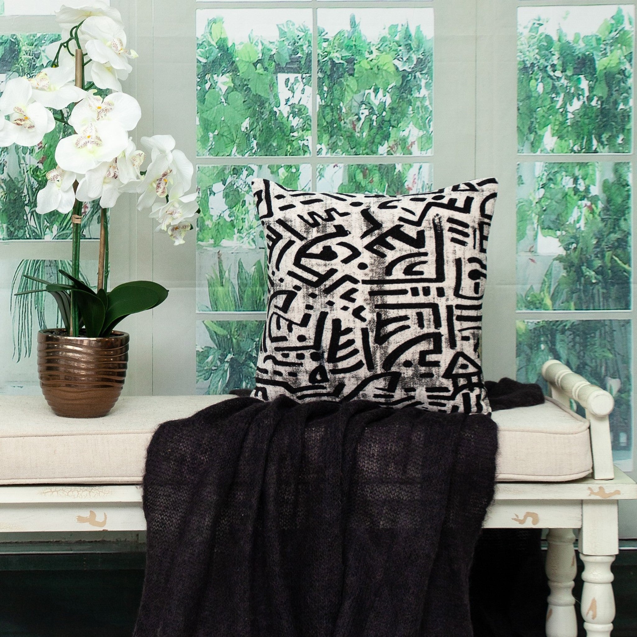 Black and white abstract velvet throw pillow with a modern design, featuring a soft velvet front and beige cotton canvas back.