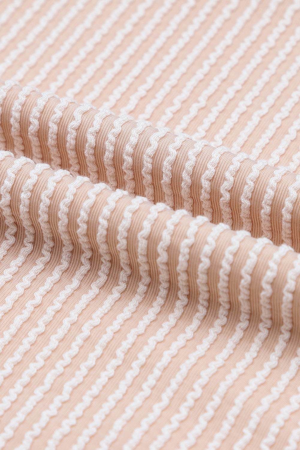 A stylish black color block long sleeve ribbed loose top displayed on a mannequin, showcasing its chic design and comfortable fit.