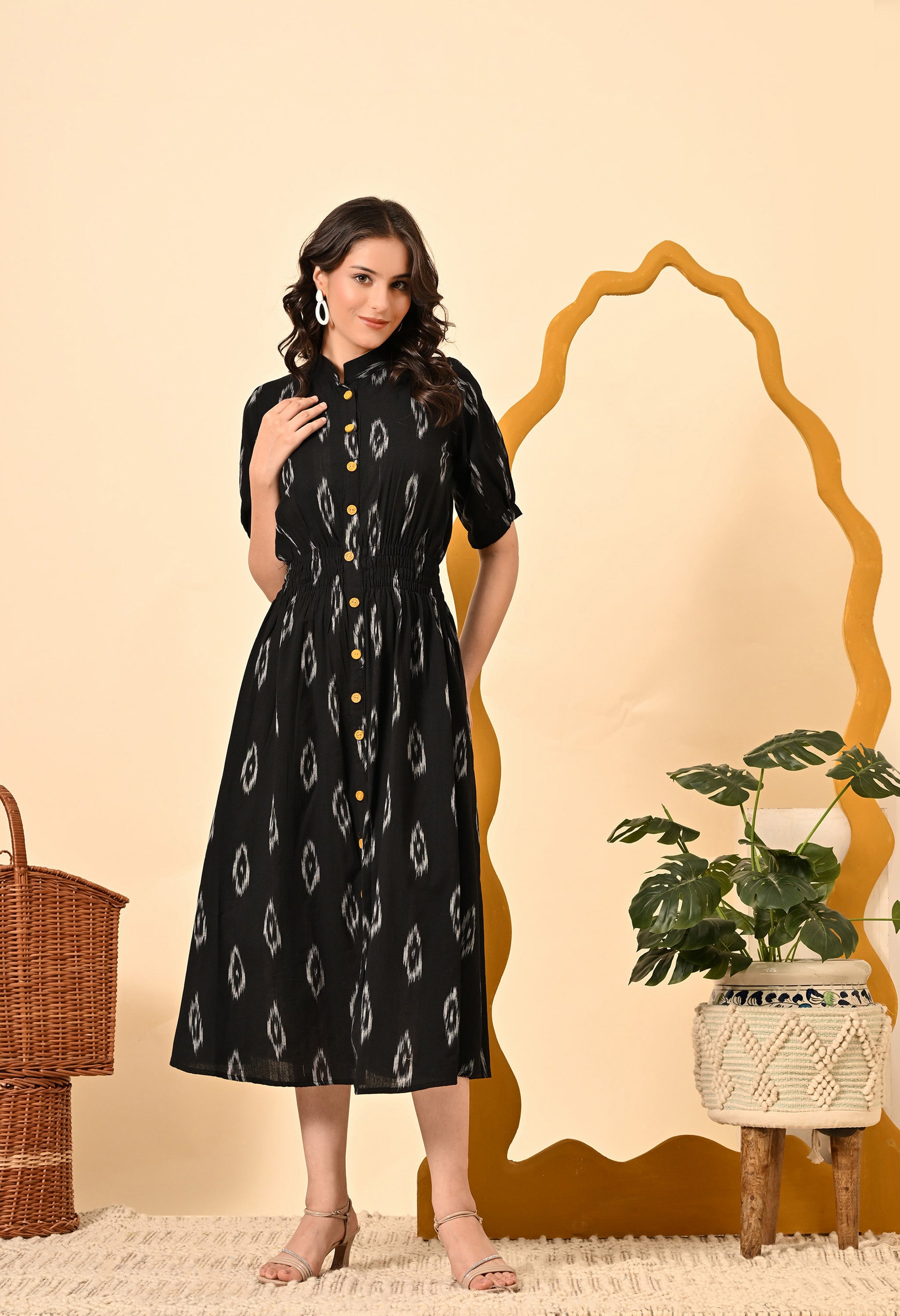 Elegant BLACK DIAMOND ELASTICATED MIDI DRESS featuring handloom ikat fabric, V neckline, and puff short sleeves, perfect for casual summer outings.