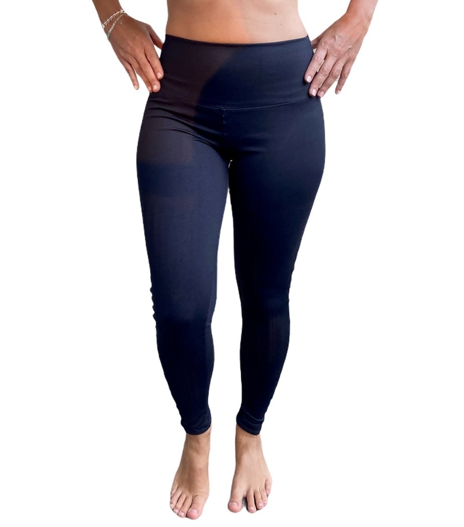 A pair of black yoga leggings featuring a high-rise waistband and side pockets, designed for comfort and style during workouts.