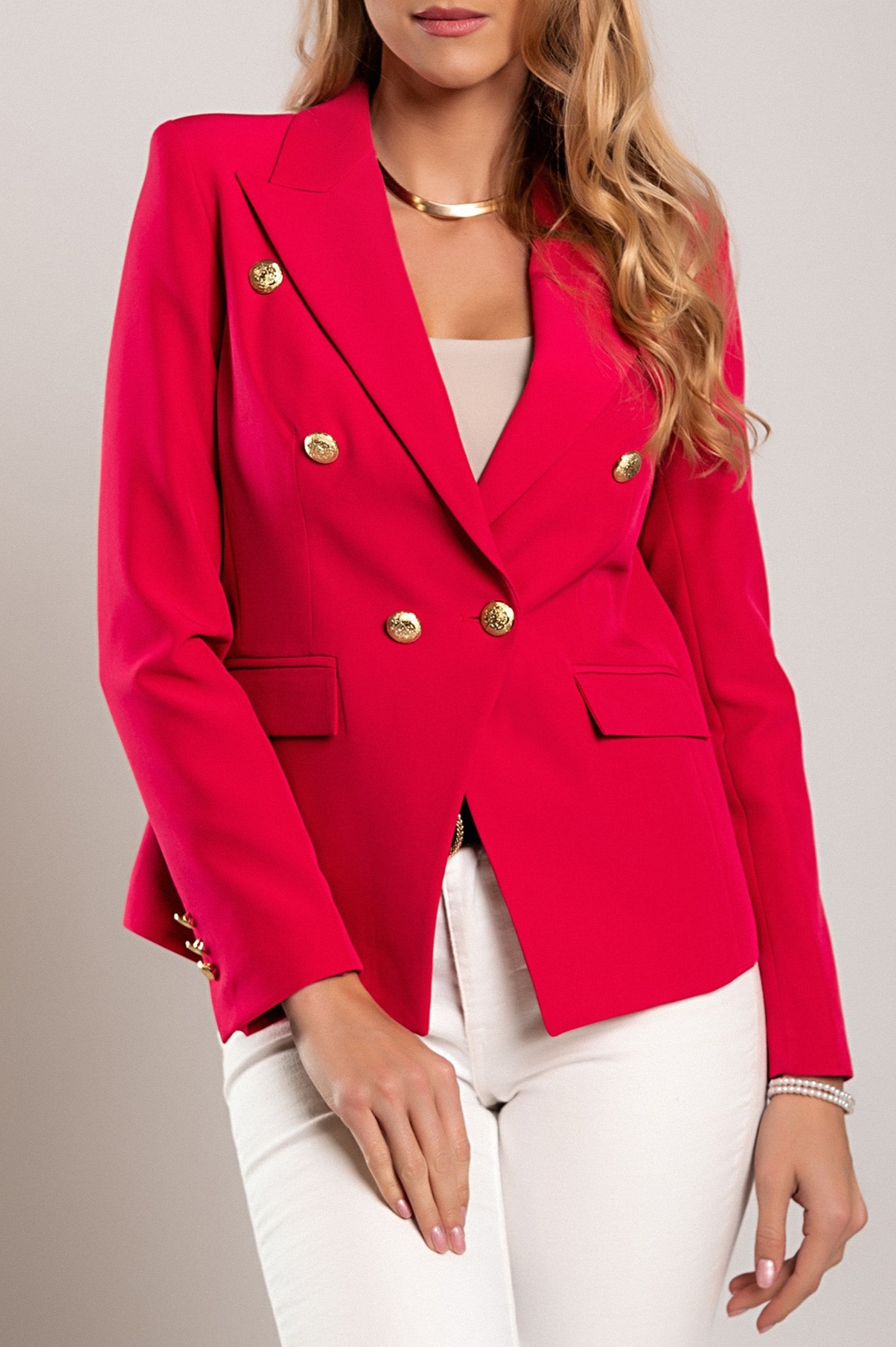 Fuchsia blazer with classic collar, padded shoulders, and long sleeves, showcasing high-quality Italian craftsmanship.