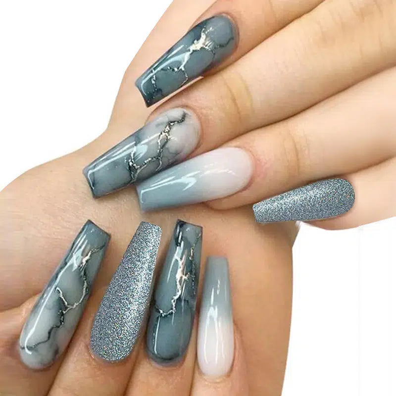 A set of Blue Slate Marble Nails featuring a glossy finish, ballerina shape, and striped marble pattern, perfect for stylish manicures.