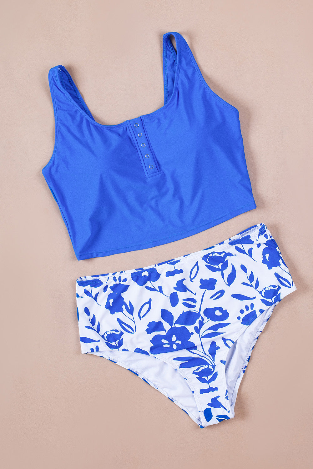 Blue square neck sleeveless tankini set featuring a stylish print and front snap button closure, perfect for beach outings.