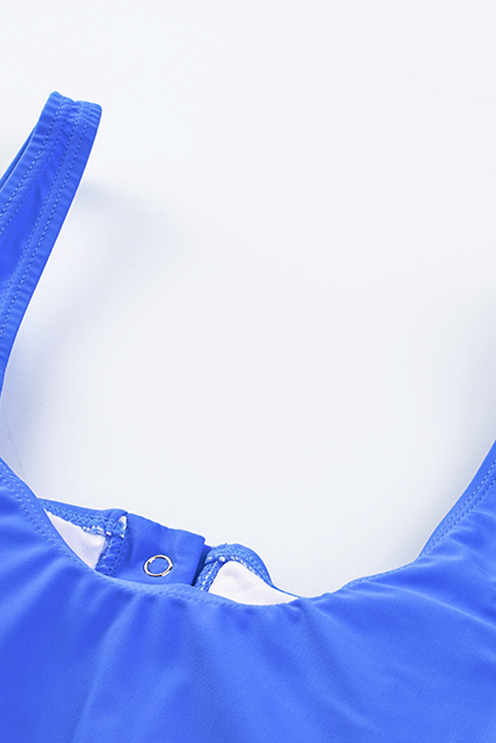 Blue square neck sleeveless tankini set featuring a stylish print and front snap button closure, perfect for beach outings.