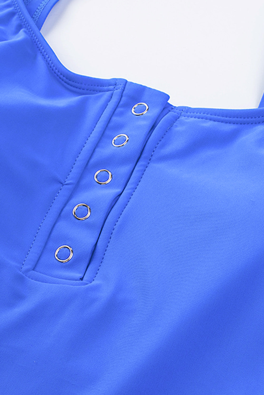 Blue square neck sleeveless tankini set featuring a stylish print and front snap button closure, perfect for beach outings.