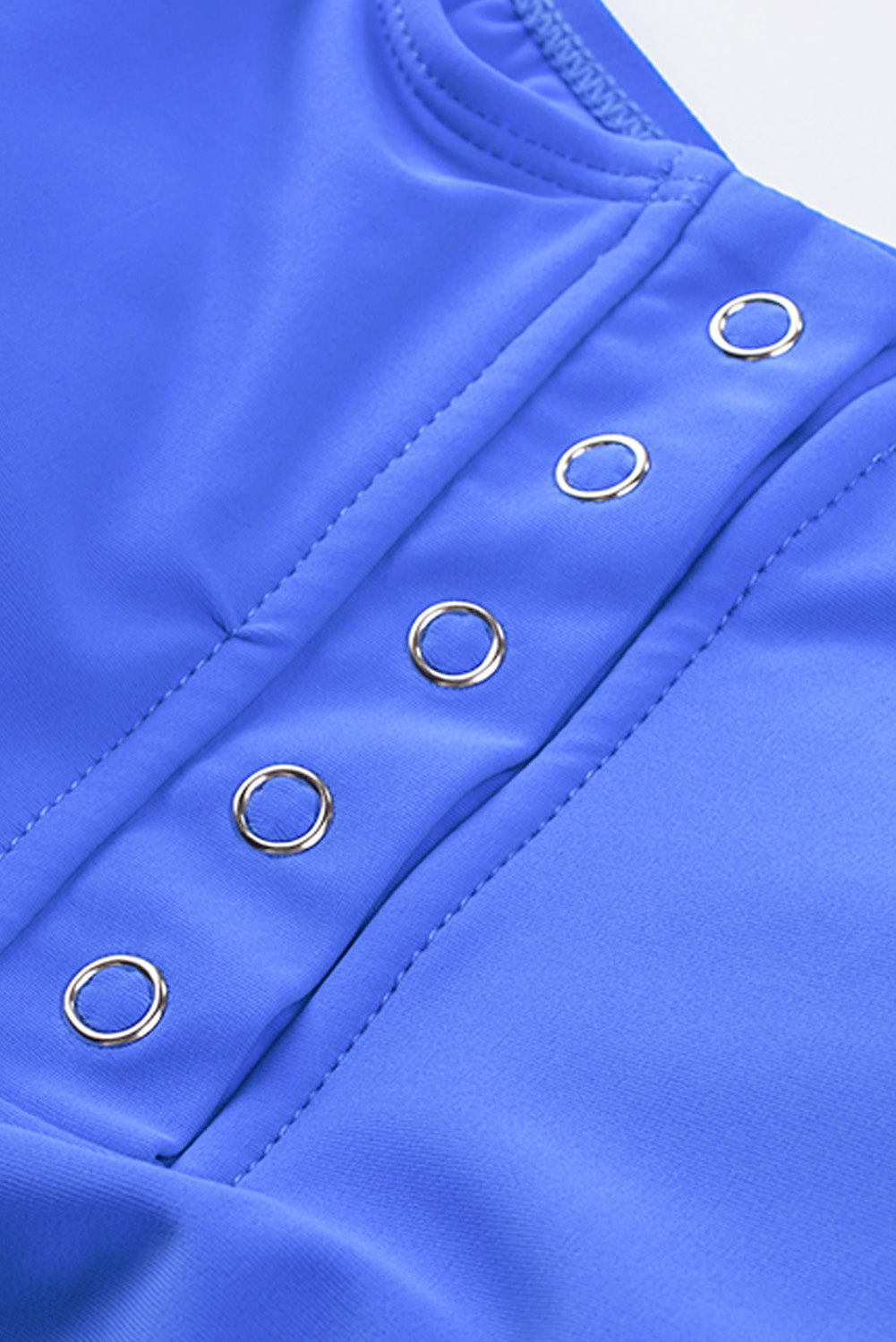 Blue square neck sleeveless tankini set featuring a stylish print and front snap button closure, perfect for beach outings.