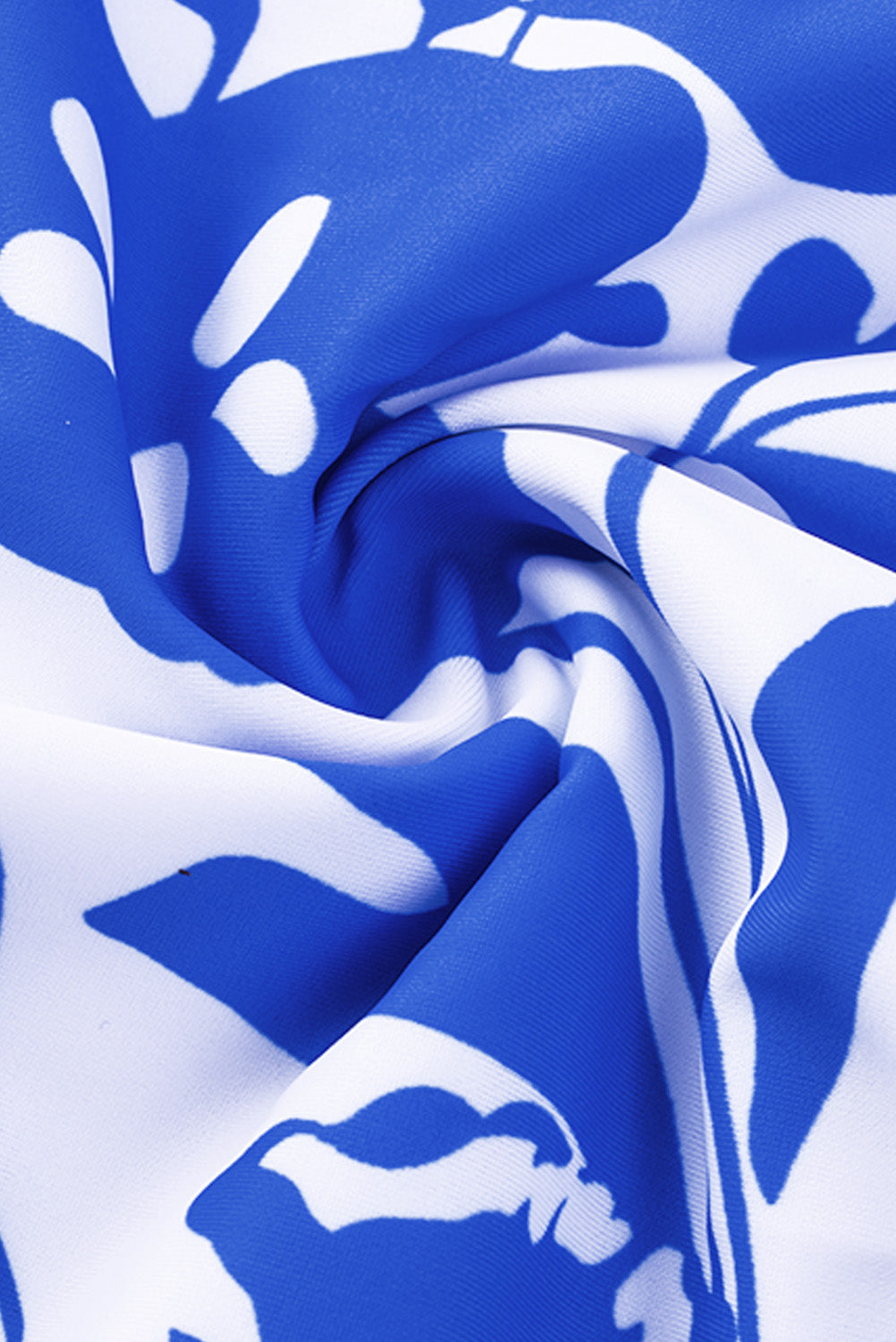 Blue square neck sleeveless tankini set featuring a stylish print and front snap button closure, perfect for beach outings.