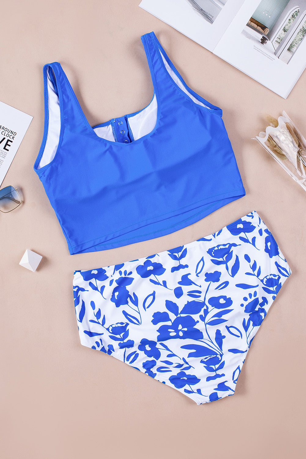 Blue square neck sleeveless tankini set featuring a stylish print and front snap button closure, perfect for beach outings.