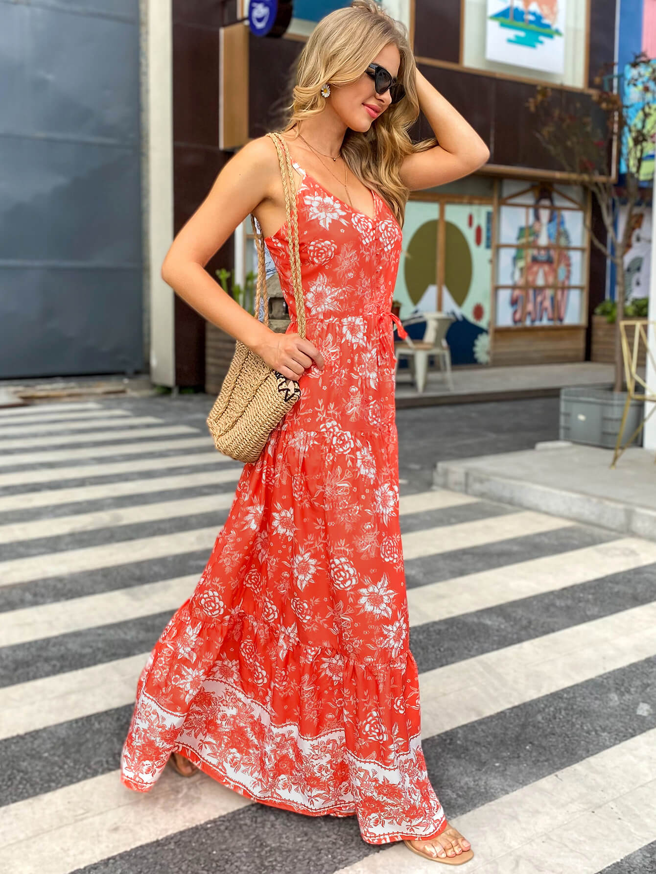 A stylish Bohemian Drawstring Waist Spaghetti Strap Maxi Dress featuring a floral pattern, sleeveless design, and a comfortable drawstring waist.