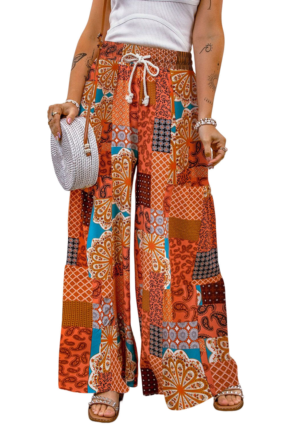 A pair of stylish Boho Drawstring Wide Leg Pants featuring a colorful patchwork design, perfect for casual and holiday wear.