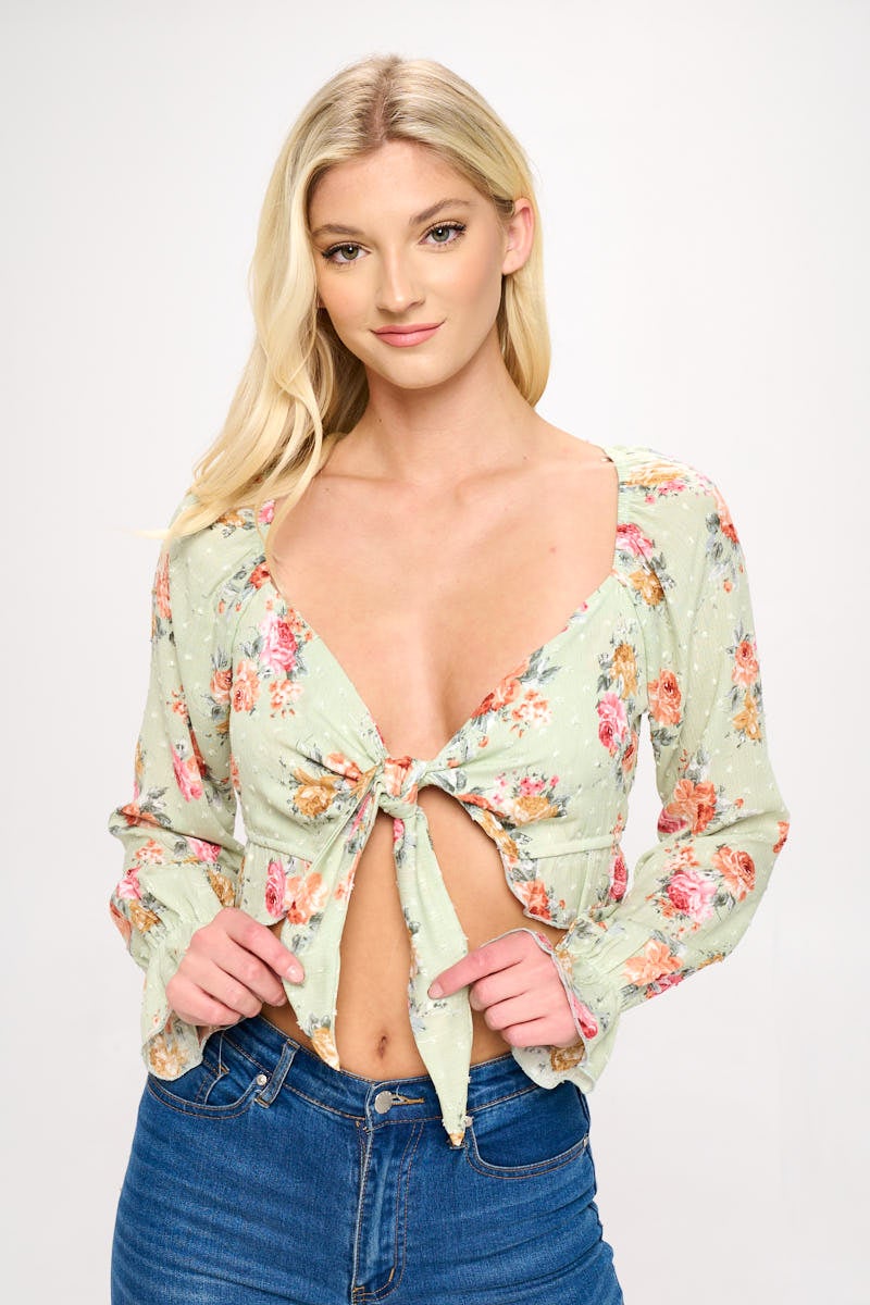 A stylish Boho Tie-Front Crop Top featuring ruffle details and long sleeves, perfect for casual outings.