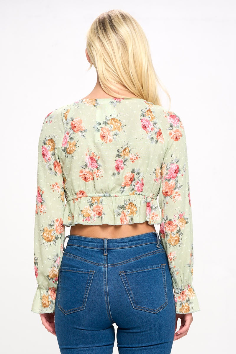 A stylish Boho Tie-Front Crop Top featuring ruffle details and long sleeves, perfect for casual outings.