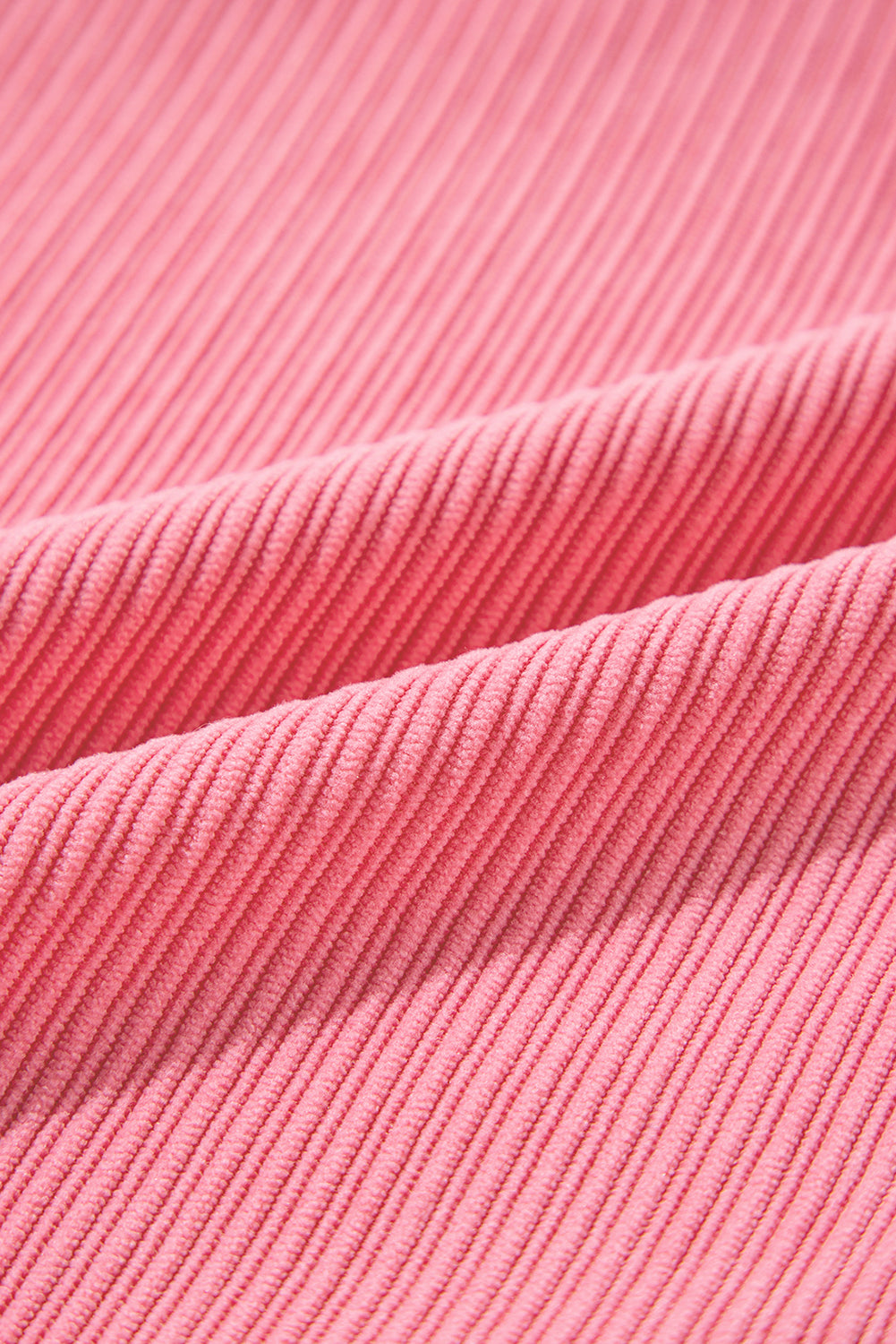 Bonbon Corduroy Button-Up Shacket featuring flap details and side splits, showcasing its stylish design and texture.